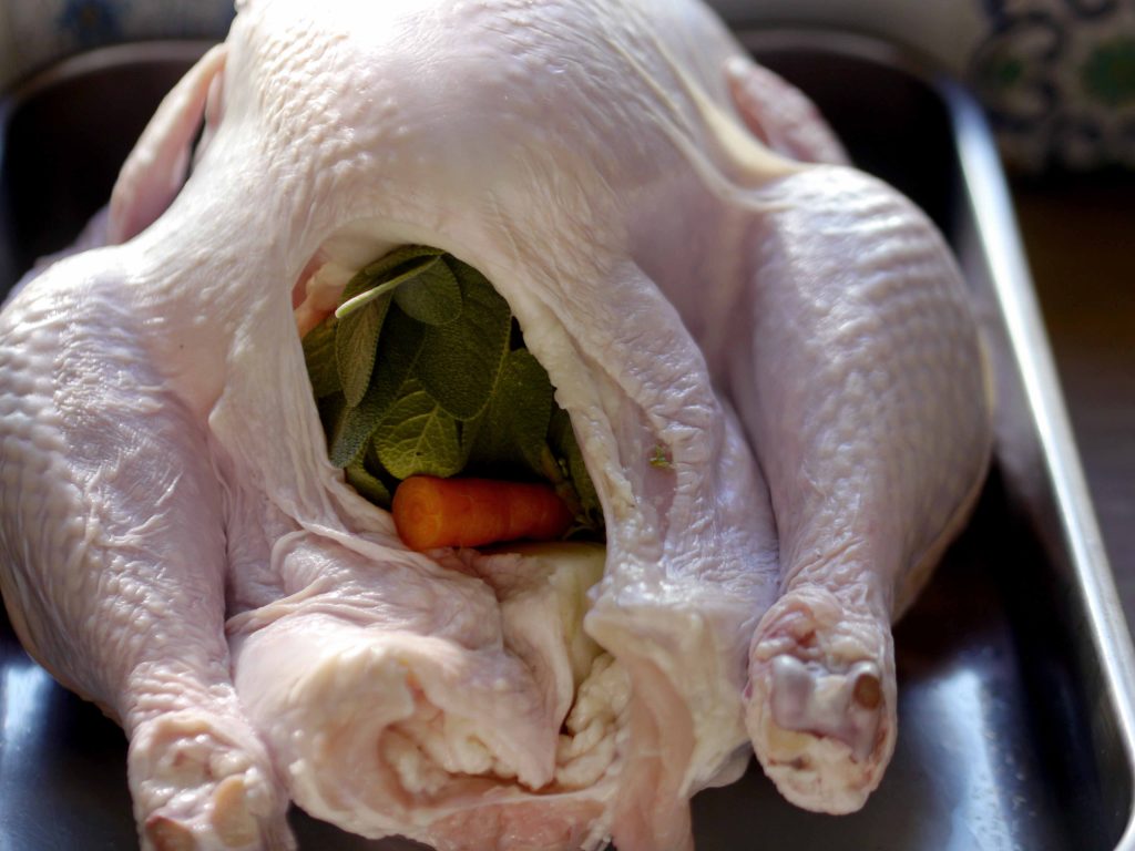 Raw turkey in a roasting pan