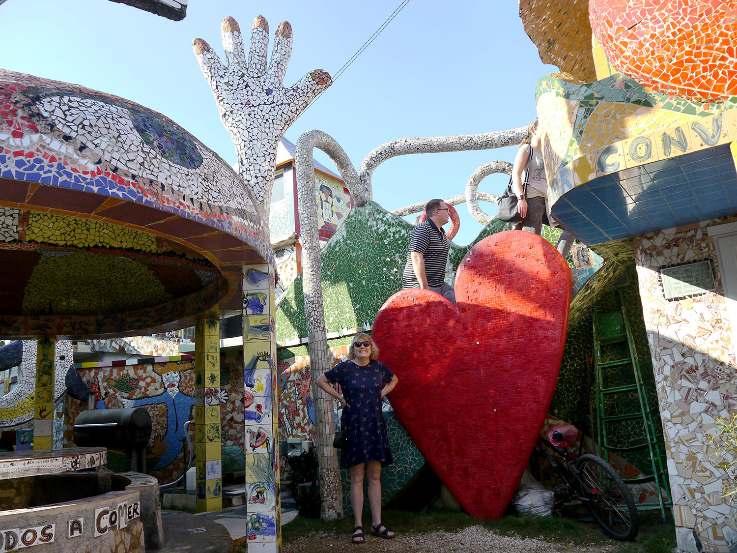 A woman and a man on the mosaic sculptures. 