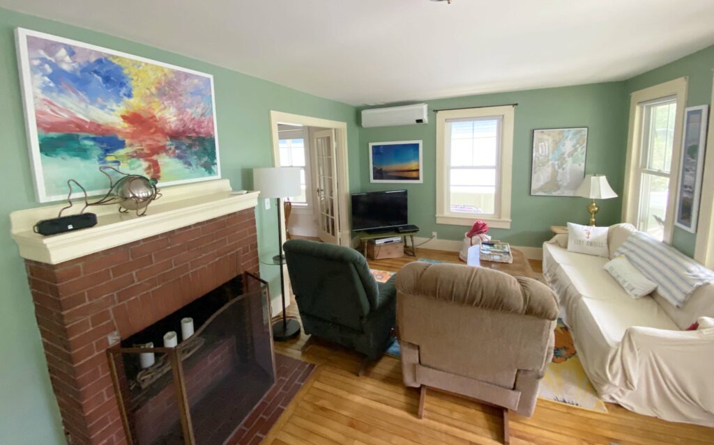 Living room with fireplace and TV.