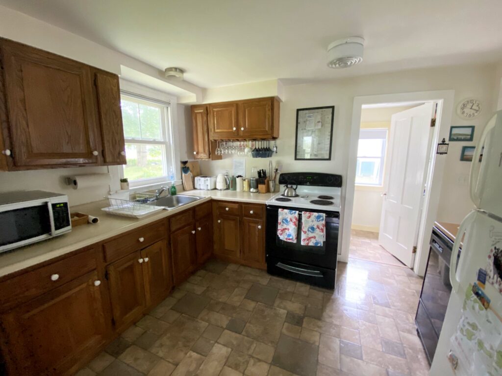 Kitchen with wood cabinets.